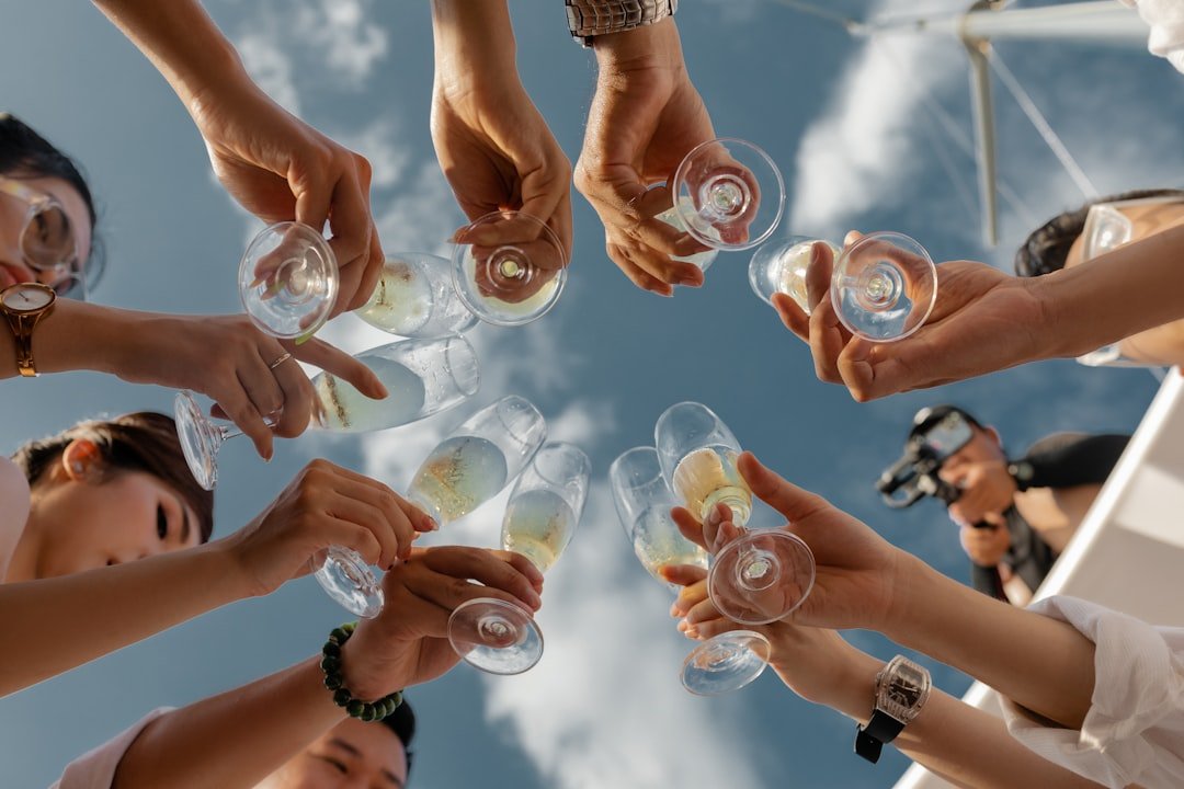 people-holding-clear-glass-bottles-during-daytime-ydse7sggb9q